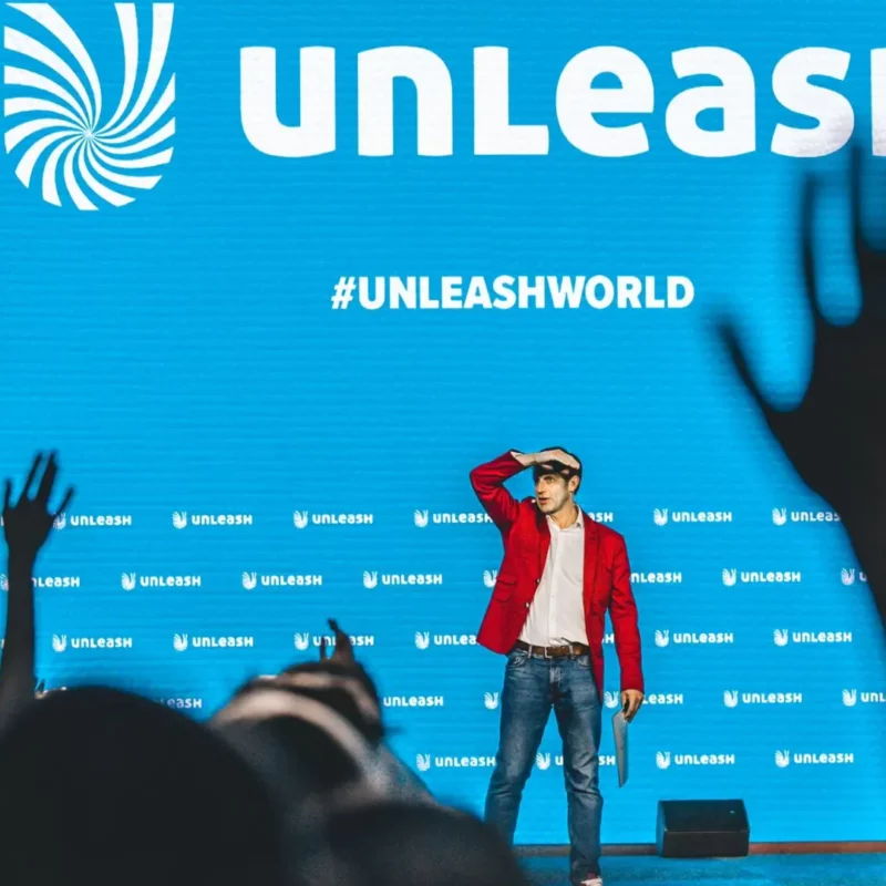 UNLEASH Host on main stage looking out at the crowd